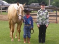 OFFKM boy with horse and 4-H volunteer.jpg