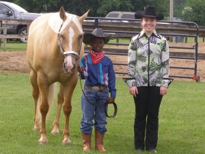OFFKM boy with horse and 4-H volunteer